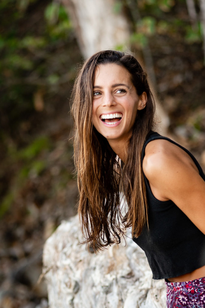 Melissa Ambrosini smiling on the beach by Noosa Photography Co