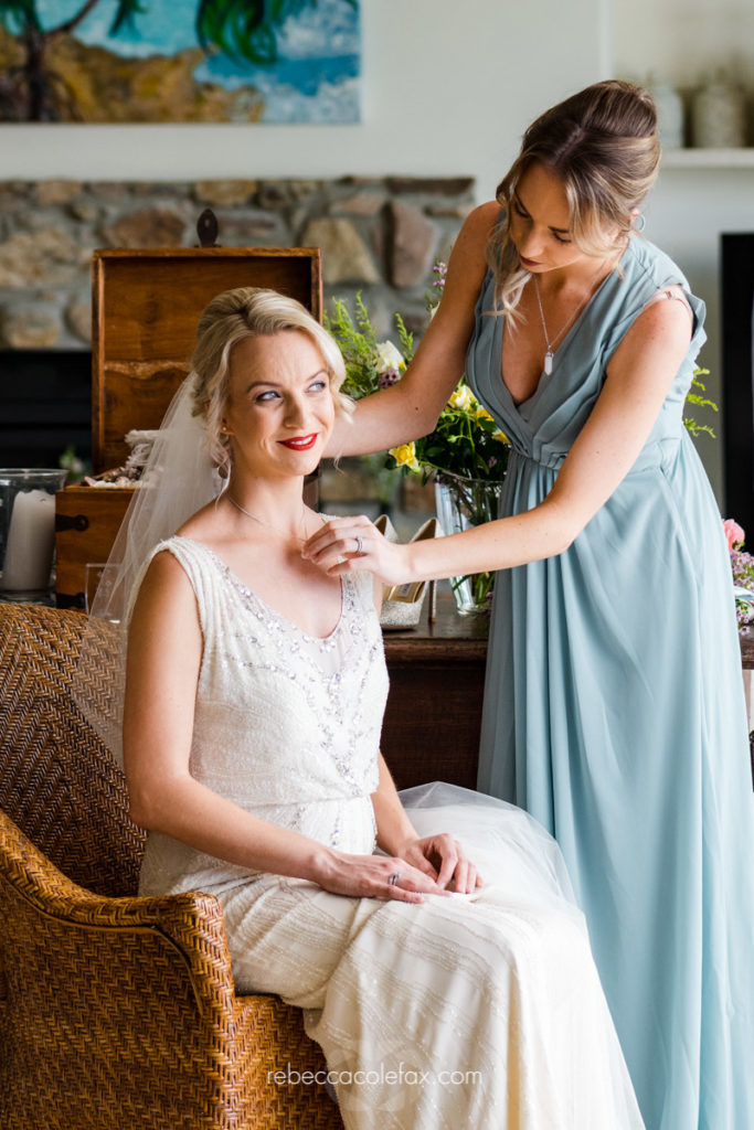 Noosa wedding photographer Casuarina Gardens bride preparation beaded gown and bridesmaid