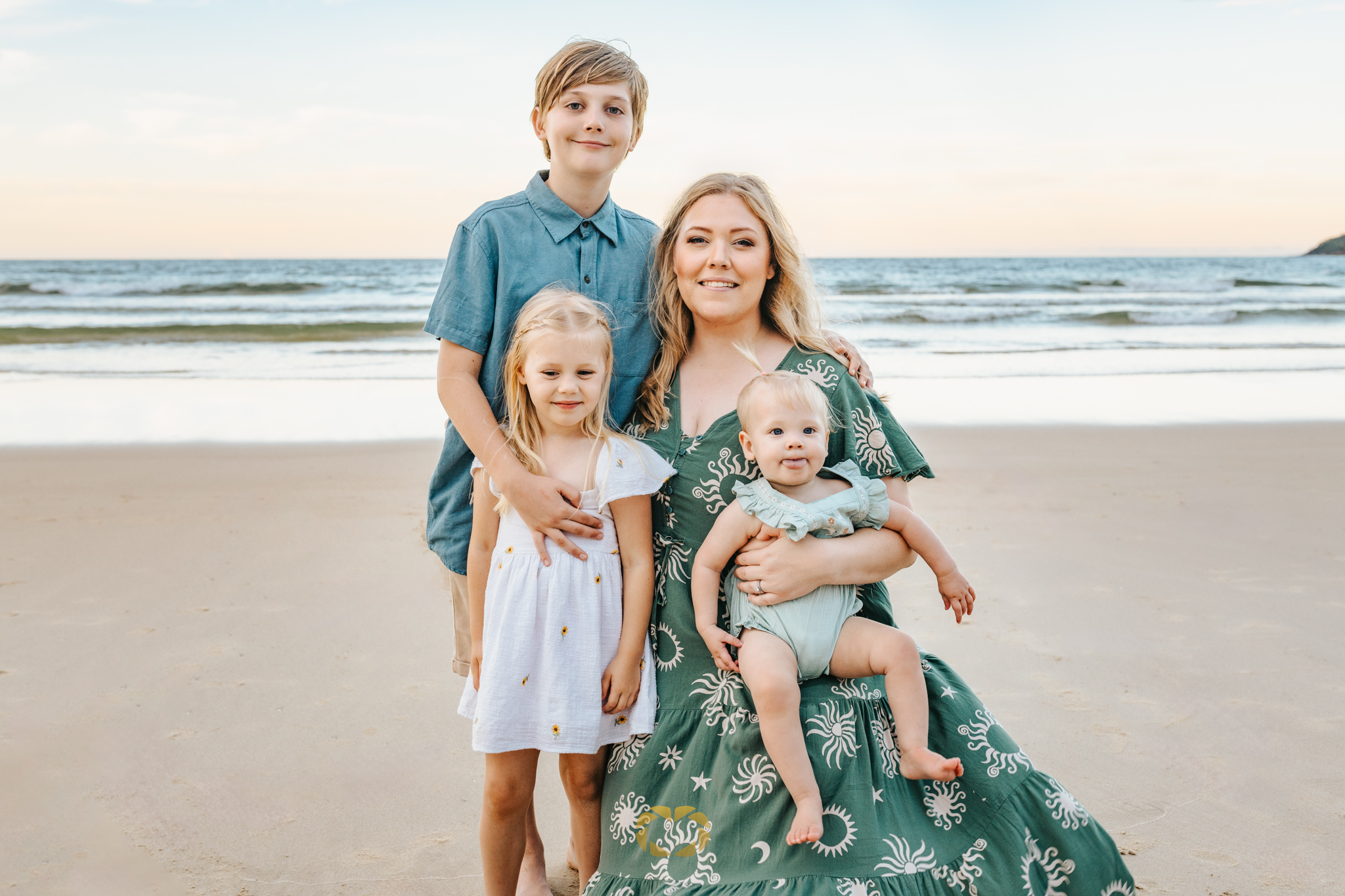 Noosa family photographer capturing a a mum and her kids on Noosa Main Beach
