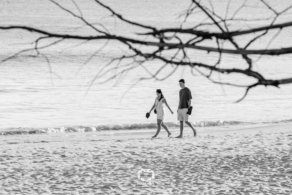 Couple on an early morning Noosa Main Beach walk