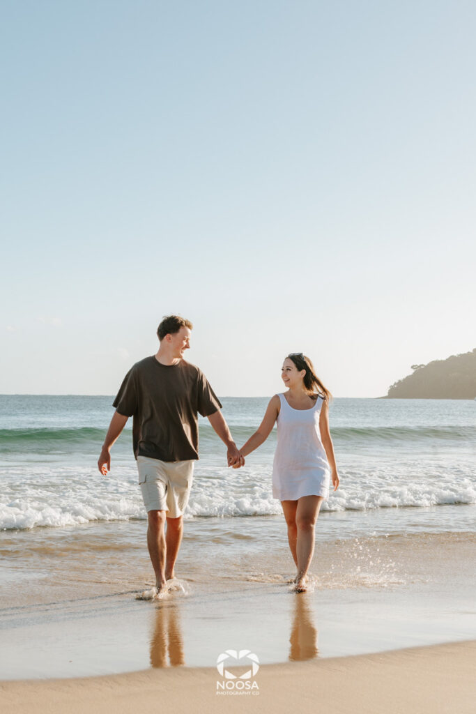 Couple enjoying Noosa Main Beach by Noosa Photography Co