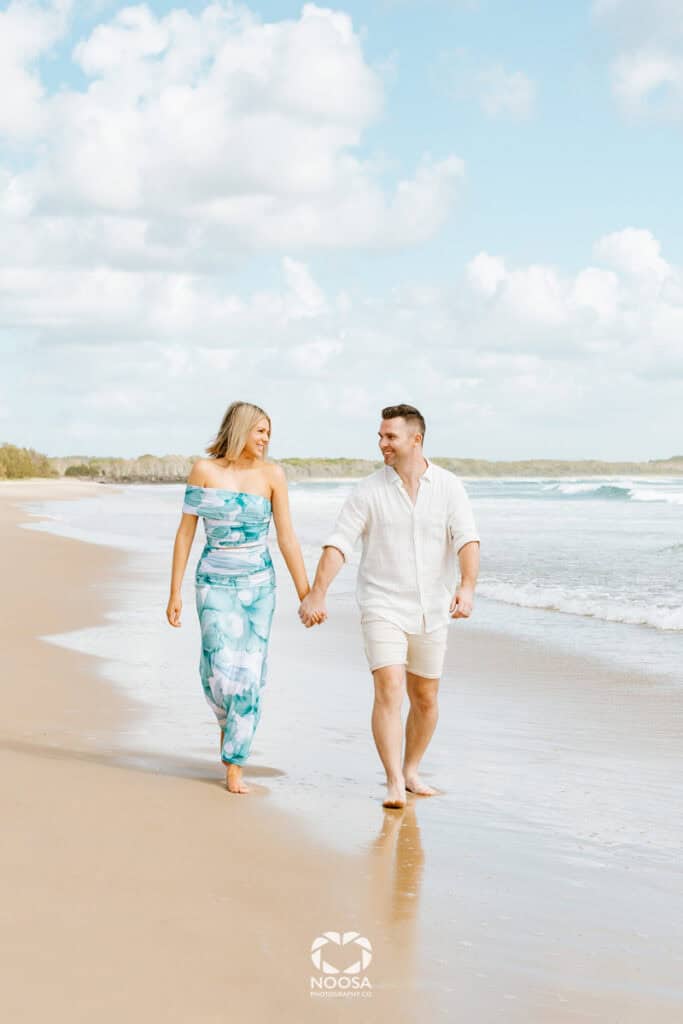 Couple walking on Noosa Main Beach