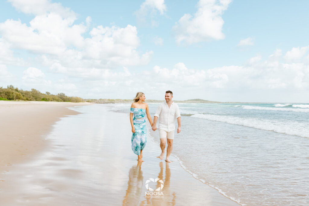Couple walking after a Proposal on Noosa Main Beach