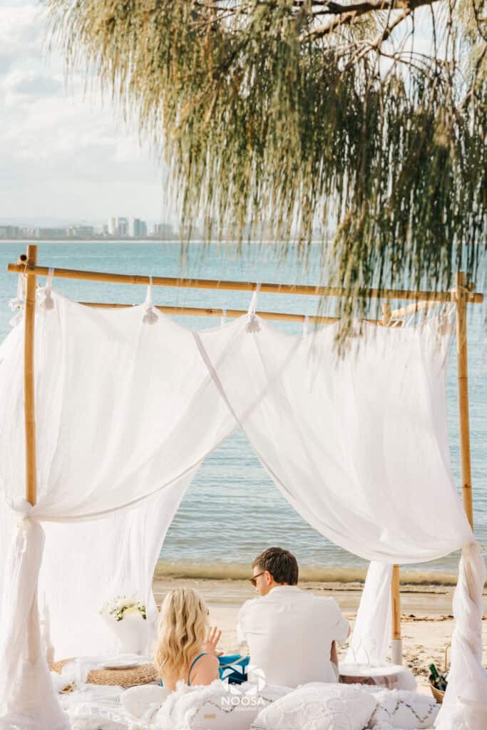 Couple enjoying their engagement by Noosa Photography Co