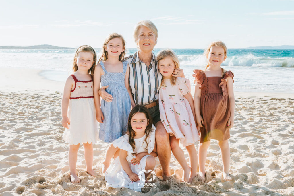 Grandma and her granddaughters on the beach Noosa
